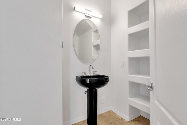 bathroom featuring tile patterned flooring and sink