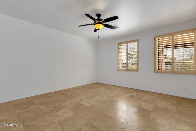 unfurnished room with ceiling fan and crown molding