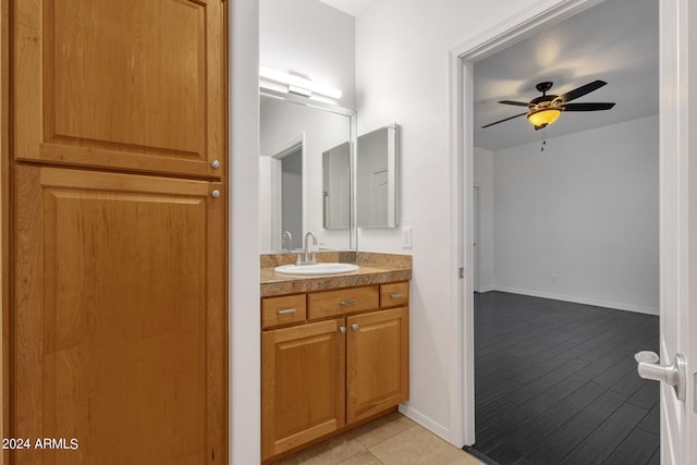 bathroom featuring tile patterned floors, ceiling fan, and vanity