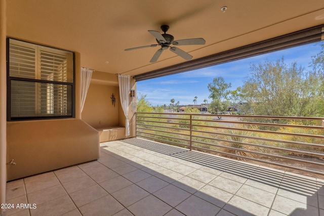 view of patio featuring ceiling fan and a balcony