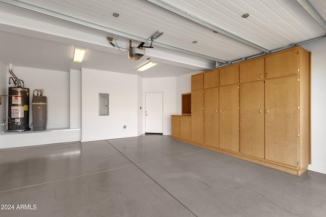 garage with electric panel, a garage door opener, and water heater