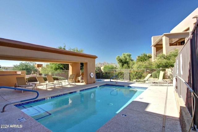 view of swimming pool featuring a patio