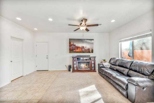 tiled living room featuring ceiling fan