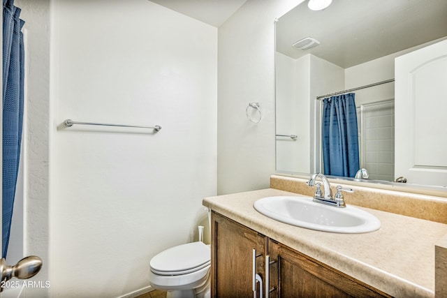 bathroom featuring vanity, a shower with curtain, and toilet