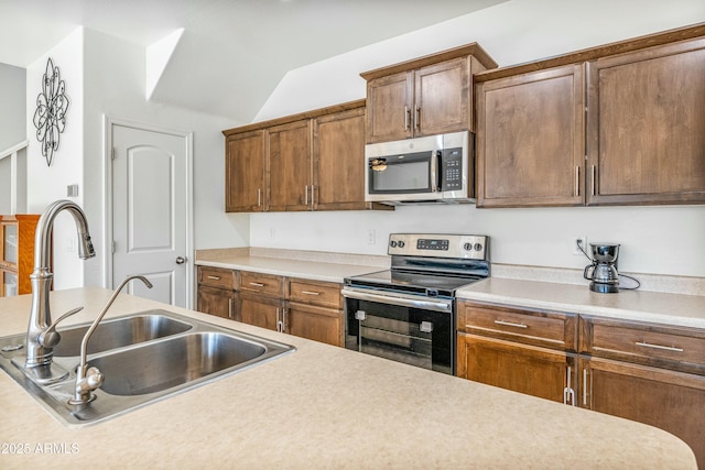 kitchen with appliances with stainless steel finishes and sink