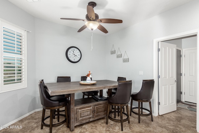 dining space featuring ceiling fan