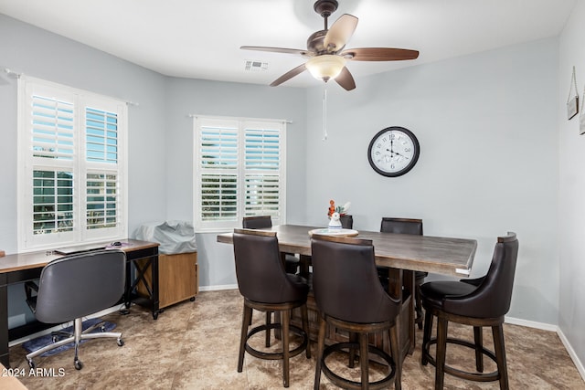 dining space featuring ceiling fan