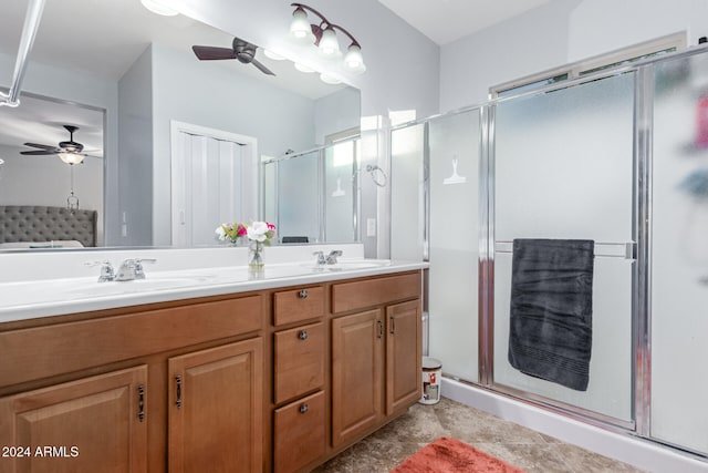 bathroom featuring vanity, walk in shower, and ceiling fan