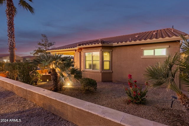 view of property exterior at dusk