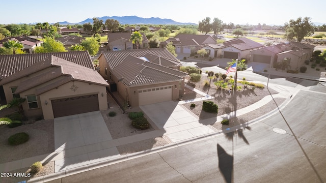 birds eye view of property featuring a mountain view