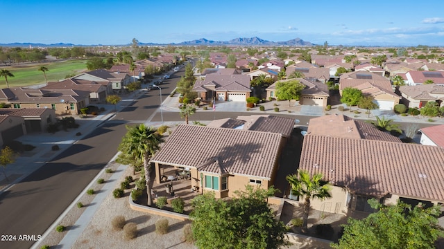 birds eye view of property with a mountain view