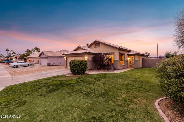 mediterranean / spanish home with a lawn