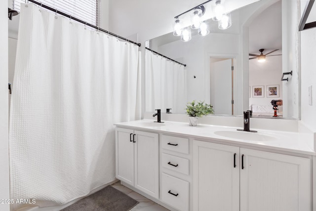 bathroom with vanity, ceiling fan, and a shower with shower curtain