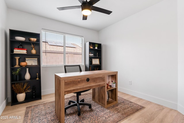 home office featuring hardwood / wood-style flooring and ceiling fan