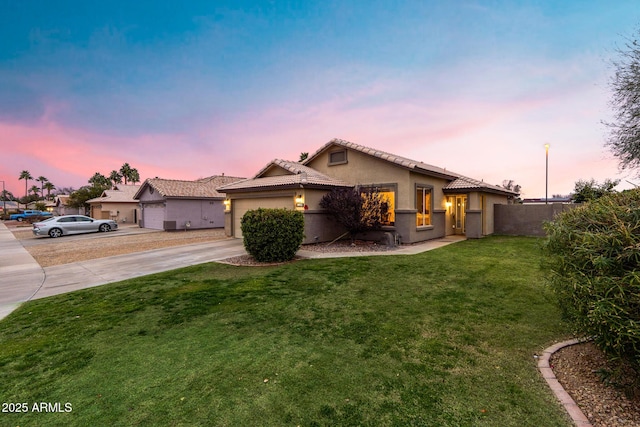 mediterranean / spanish-style house with a yard