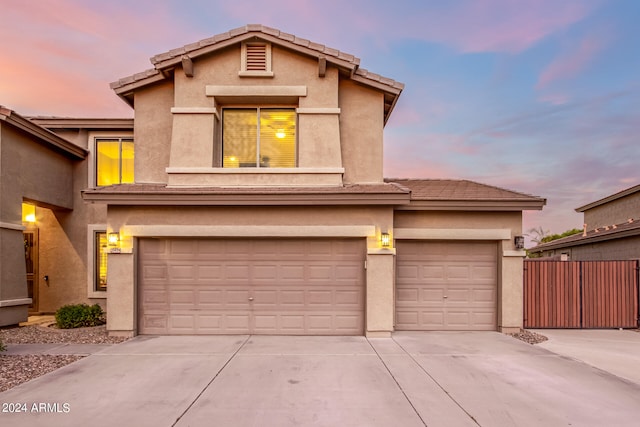 front facade with a garage