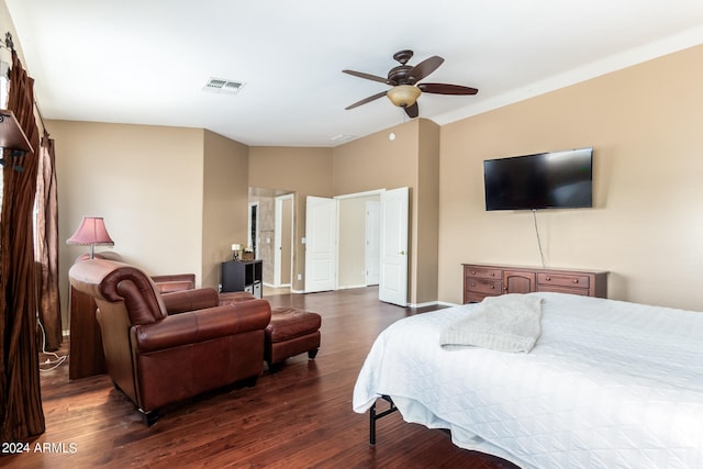 bedroom with ceiling fan and dark hardwood / wood-style floors