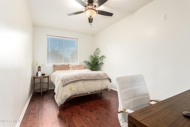 bedroom with dark wood-type flooring, ceiling fan, and vaulted ceiling