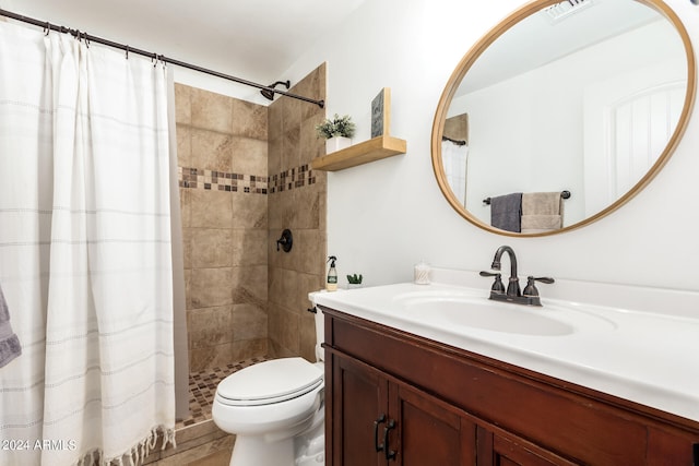 bathroom with vanity, toilet, and a shower with shower curtain