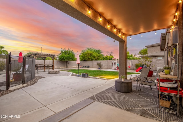 view of patio terrace at dusk