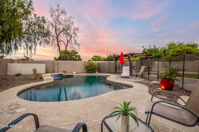 pool at dusk with a pergola and a patio