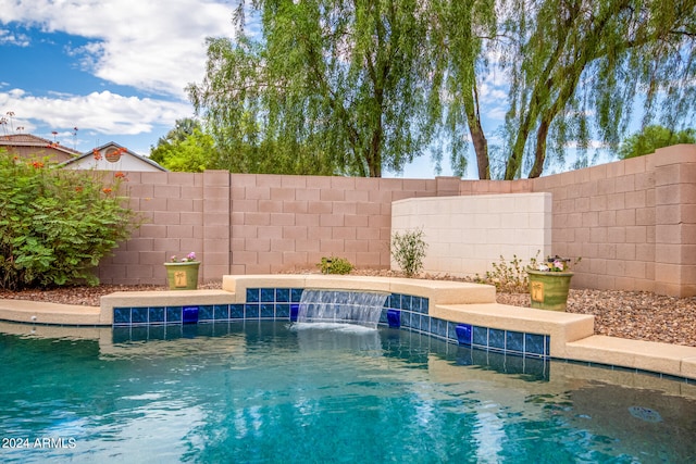 view of pool with pool water feature