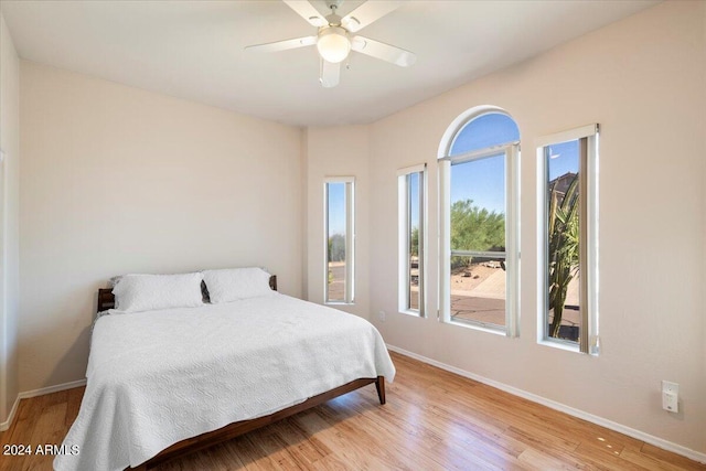 bedroom featuring ceiling fan and light hardwood / wood-style flooring