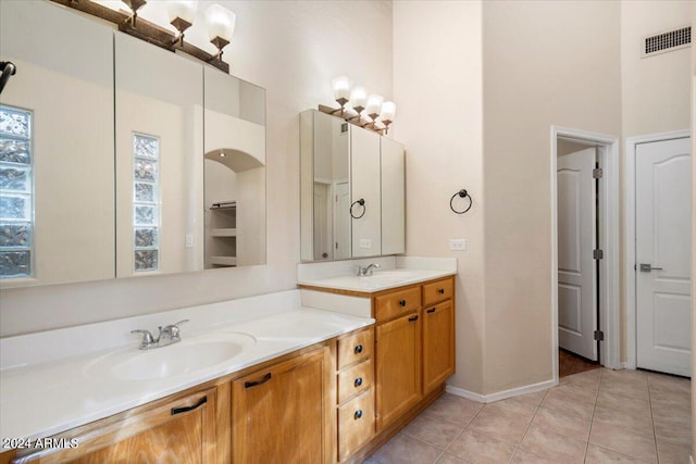 bathroom with tile patterned floors and vanity