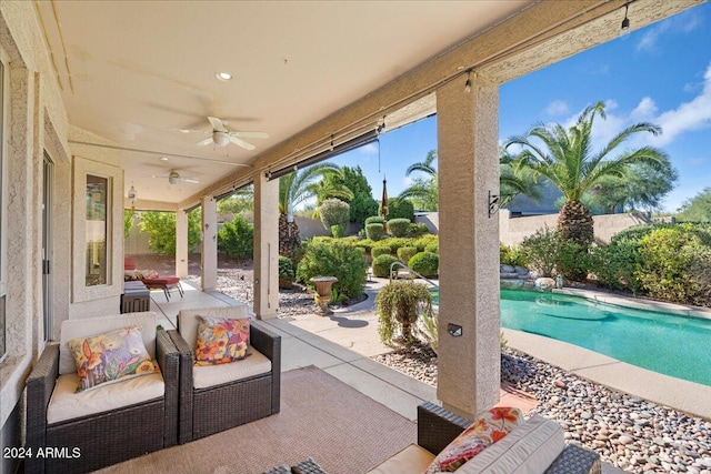 view of patio / terrace with ceiling fan, an outdoor hangout area, and a fenced in pool