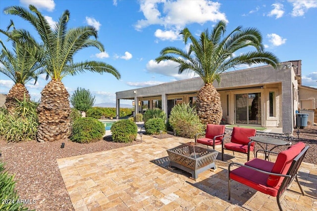 view of patio / terrace featuring an outdoor fire pit