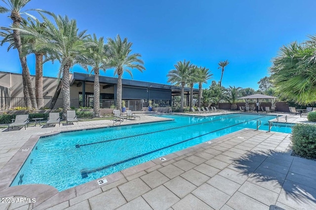 view of swimming pool with a patio