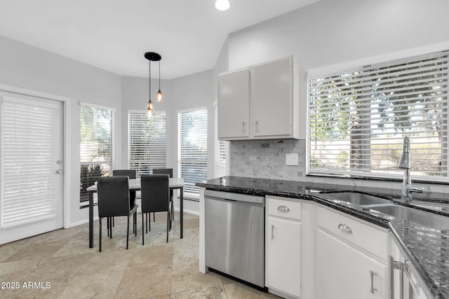 kitchen featuring sink, white cabinetry, decorative light fixtures, dishwasher, and dark stone counters