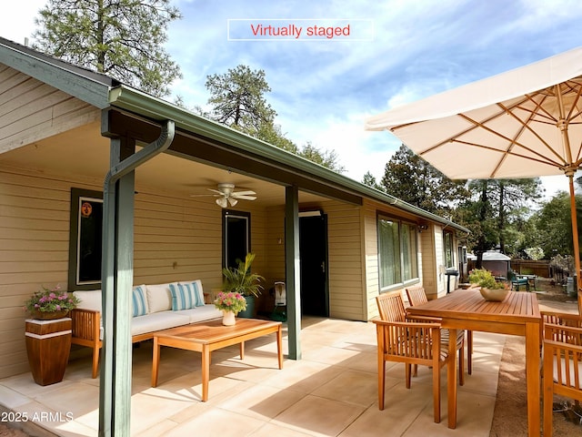 exterior space featuring an outdoor living space and a ceiling fan