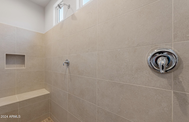 bathroom featuring a tile shower