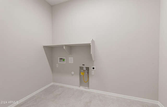 laundry area with hookup for a gas dryer, hookup for a washing machine, light colored carpet, and electric dryer hookup