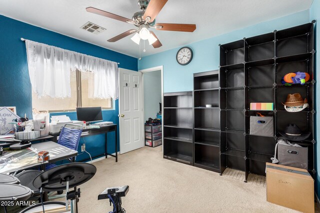 office featuring carpet and ceiling fan