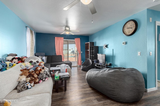 living room featuring a textured ceiling and dark wood-type flooring