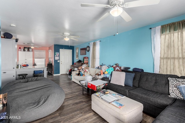 living room with dark hardwood / wood-style floors and ceiling fan