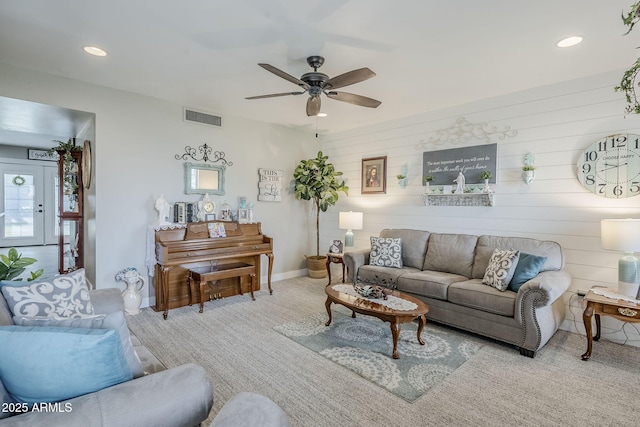 living room with recessed lighting, visible vents, baseboards, and a ceiling fan