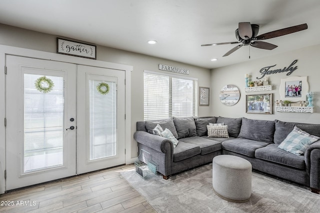 living area with recessed lighting, french doors, light wood-style flooring, and a ceiling fan