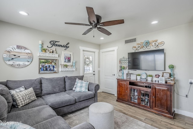 living area featuring visible vents, recessed lighting, light wood-type flooring, and a ceiling fan