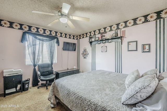 bedroom with a textured ceiling, ceiling fan, and carpet flooring