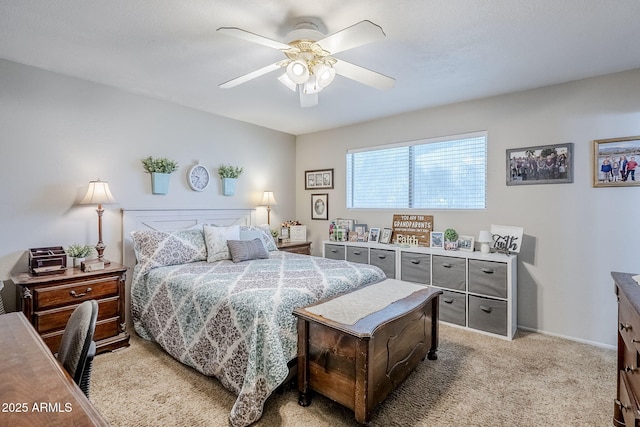 bedroom featuring a ceiling fan, light colored carpet, and baseboards