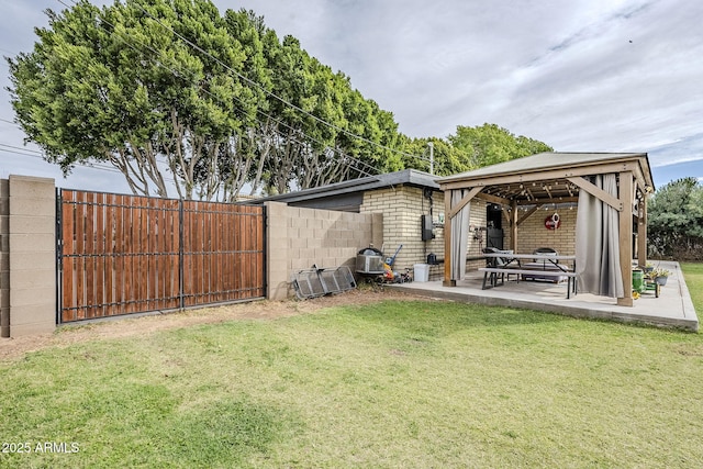 view of yard with a gazebo, a patio area, and fence