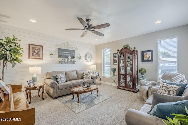 living area with recessed lighting, plenty of natural light, carpet flooring, and ceiling fan