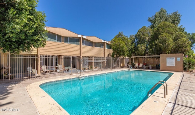 view of swimming pool featuring a patio area