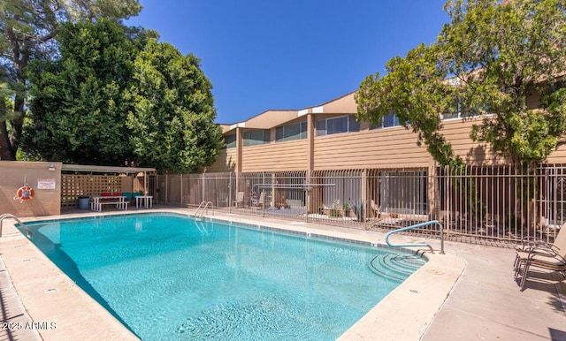 view of swimming pool featuring a patio area