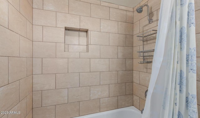 bathroom with shower / bathtub combination with curtain