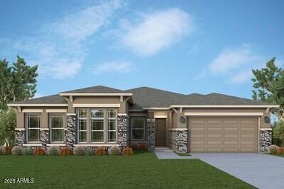 prairie-style home featuring a front yard and a garage