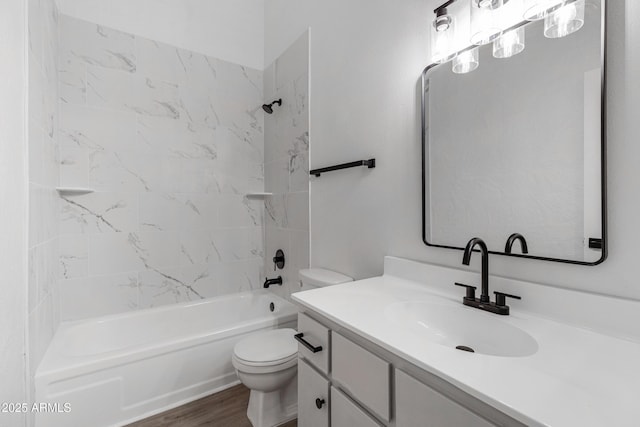 full bathroom with toilet, vanity,  shower combination, and wood finished floors